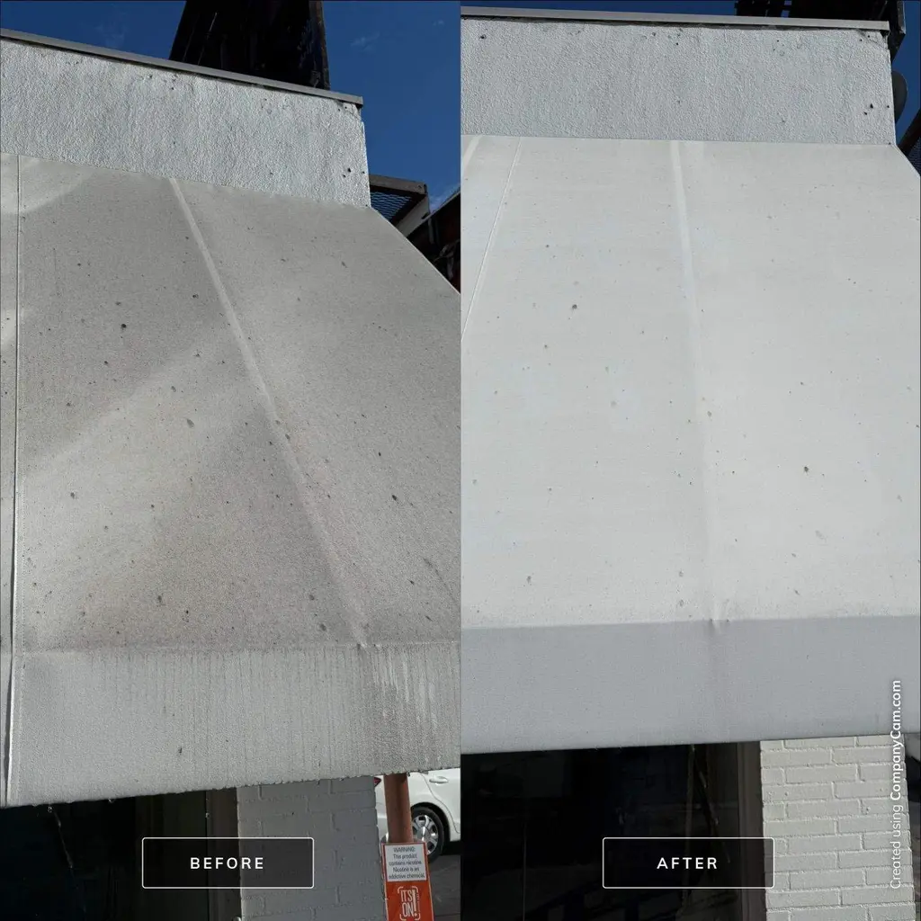 Painted concrete overhang before and after building washing